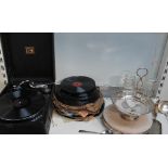 An HMV table top record player together with records,