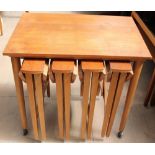 A teak nest of five tables