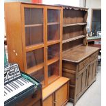 A 20th century oak dresser together with a teak bookcase