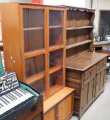 A 20th century oak dresser together with a teak bookcase
