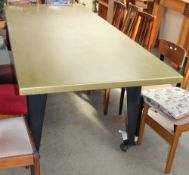 A large gilt decorated refectory table together with a foot stool