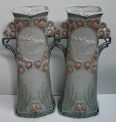 A pair of Royal Dux vases, moulded with pine cones and Stags,