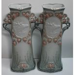A pair of Royal Dux vases, moulded with pine cones and Stags,