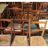 A large collection of chairs including dining chairs, bedroom chairs,