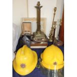 A Devon Fire and Rescue Helmet, together with another fireman helmet, flatwares,