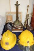 A Devon Fire and Rescue Helmet, together with another fireman helmet, flatwares,