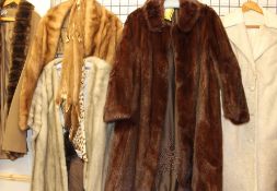 A three-quarter length fur coat together with a collection of fur and faux fur coats, jackets,