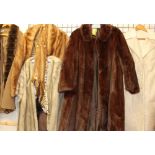 A three-quarter length fur coat together with a collection of fur and faux fur coats, jackets,