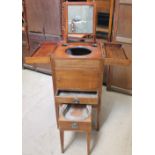 A Gentleman's wash stand / night table with a hinged top enclosing a sliding mirror,