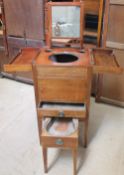 A Gentleman's wash stand / night table with a hinged top enclosing a sliding mirror,