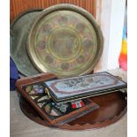 A mahogany twin handled tray together with a brass tray tops,