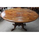 A Victorian walnut inlaid oval topped supper table