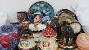 A pair of J Kent ginger jars and covers, together with Bells whisky decanters,