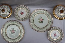 A pair of 19th century porcelain sauce tureens, covers, stands and matching plates,