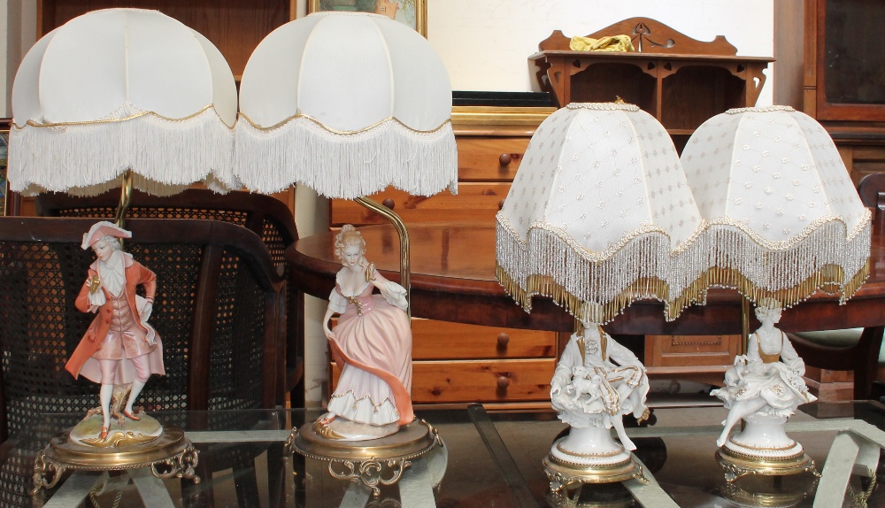 A pair of Capodimonte porcelain figural table lamps together with another pair of Capodimonte table