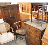An elm seated captain's chair together with an oak cupboard, a bergère backed elbow chair,