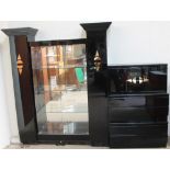 A modern black lacquer display cabinet together with side cabinets,