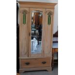 A Satin walnut wardrobe with a mirrored door and base drawer on bracket feet,