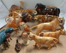 A large quantity of Beswick figures including lions, leopard, tiger, kingfisher, barn owls, stag,