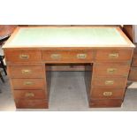 A reproduction mahogany pedestal desk with a leather inset top,