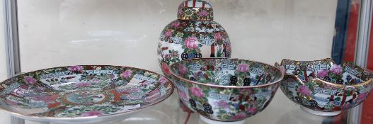 A modern famille rose ginger jar and cover together with bowls and a plate