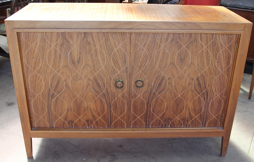 A 20th century teak sideboard with a rectangular top above a pair of cupboard doors with crossover - Image 2 of 2