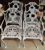 A white painted garden table and four chairs