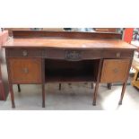 A 20th century mahogany sideboard with drawers and cupboards on square legs and square feet