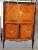 A reproduction continental kingwood drinks cabinet with a serpentine top above a drop front with a