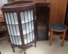 A 20th century mahogany display cabinet together with a modern display cabinet and a low table