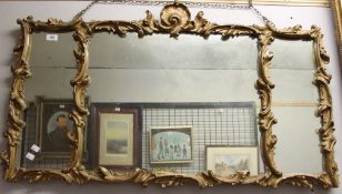 A gilt decorated gilt gesso mirror with three plates together with another mirror