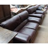 A leather three-piece suite comprising a three seater settee,