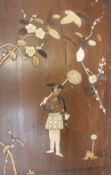 A Japanese panel inset with Bone and mother of pearl composing a figure,