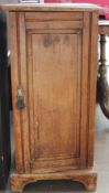 A satin walnut pot cupboard