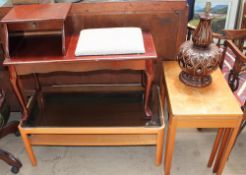 A teak nest of tables together with a telephone table,