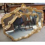 A pair of gilt decorated wall mirrors together with a collection of gilt wall mirrors