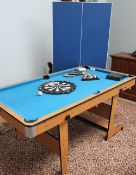 A folding games table for snooker or table tennis together with a dartboard etc