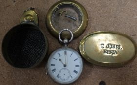 A silver open faced pocket watch in a brass case together with a brass tobacco twist tin