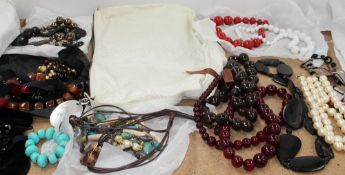 A Salvadore Ferragamo hand bag together with a quantity of costume jewellery necklaces etc