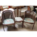 A pair of bergère elbow chairs on square tapering legs together with an Edwardian mahogany salon