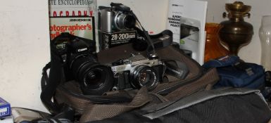 A Canon Eos 400D digital camera, together with a Canon AE-1 35mm camera, other cameras and lenses,