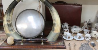 A horn gong together with a walnut mantle clock, Carlton china crested ware pig,