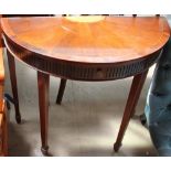A reproduction mahogany D shaped side table with a fan decoration and a single drawer on square