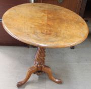 A Victorian walnut tripod table,