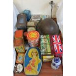 A tin helmet together with assorted tins etc