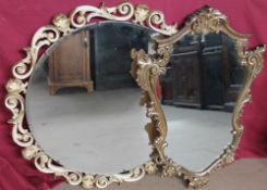 A circular gilt and cream wall mirror together with another gilt wall mirror