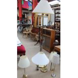 A brass standard lamp together with four table lamps,