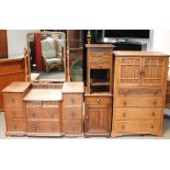 A 20th century oak dressing table with three banks of drawers together with a matching tallboy a