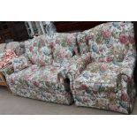 An upholstered two seater sofa bed together with a matching arm chair