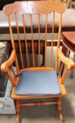 A spindle back rocking chair